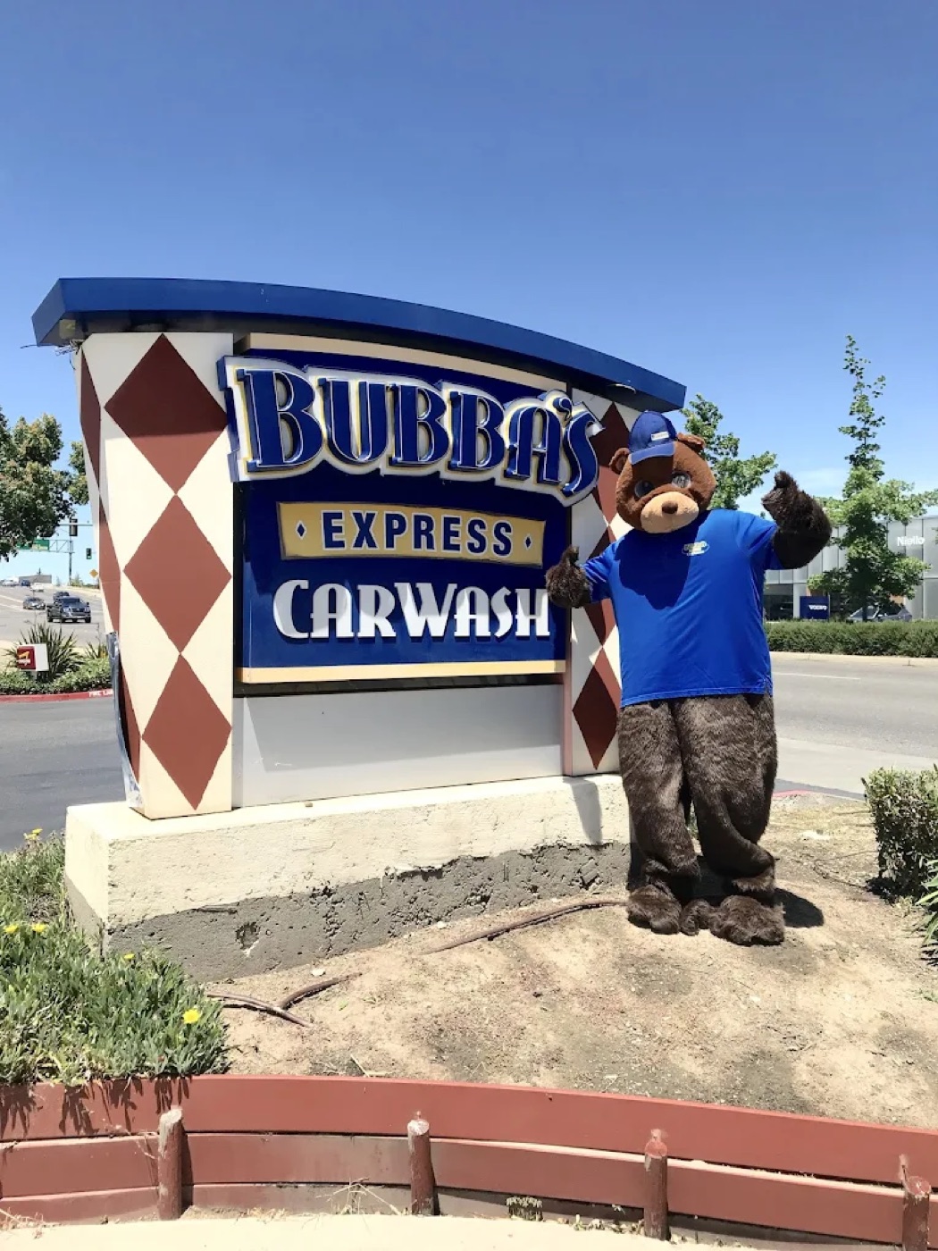 Bubba's Express Car Wash mascot in front of the Citrus Heights location sign