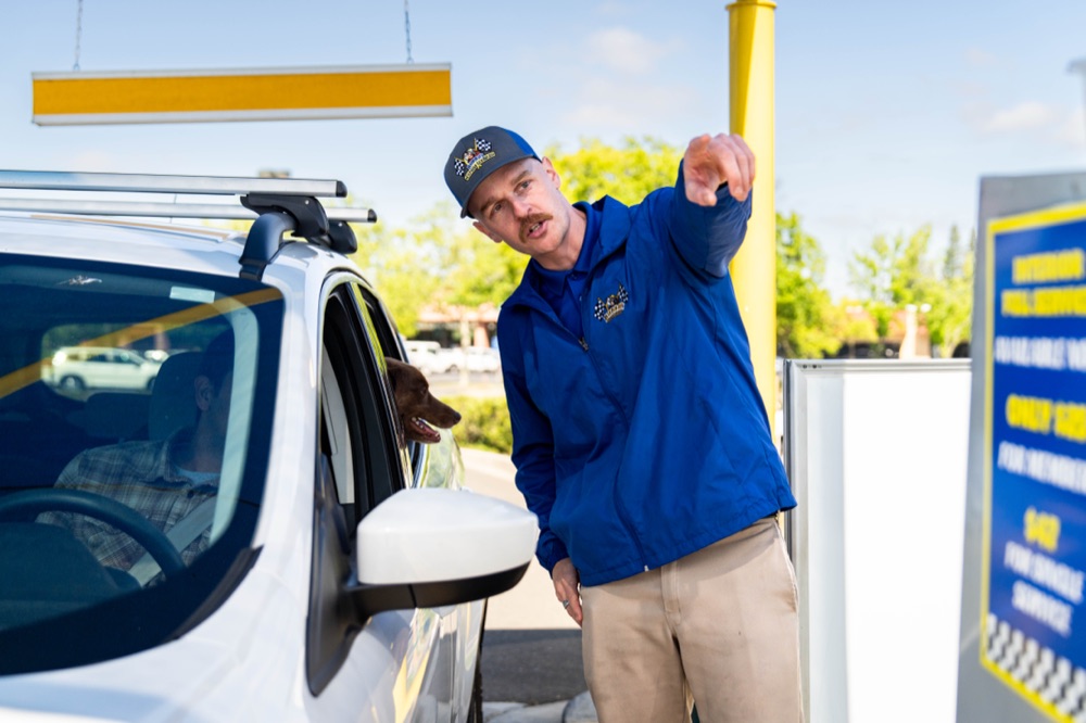 Bubba's team member greeting a customer at the pay station