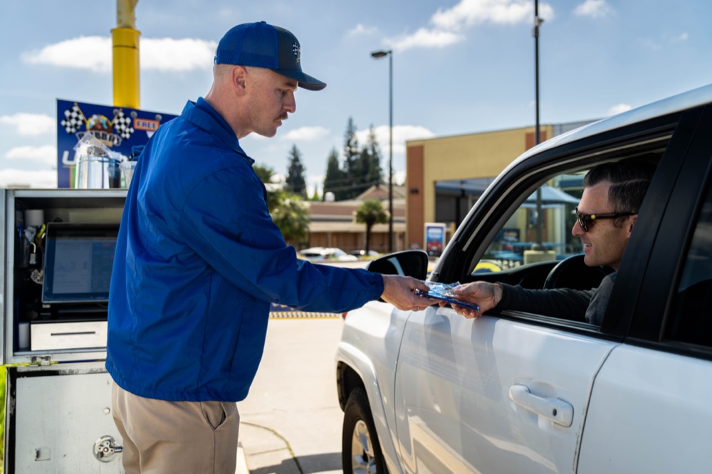 Bubba's team member processing a membership payment with a customer