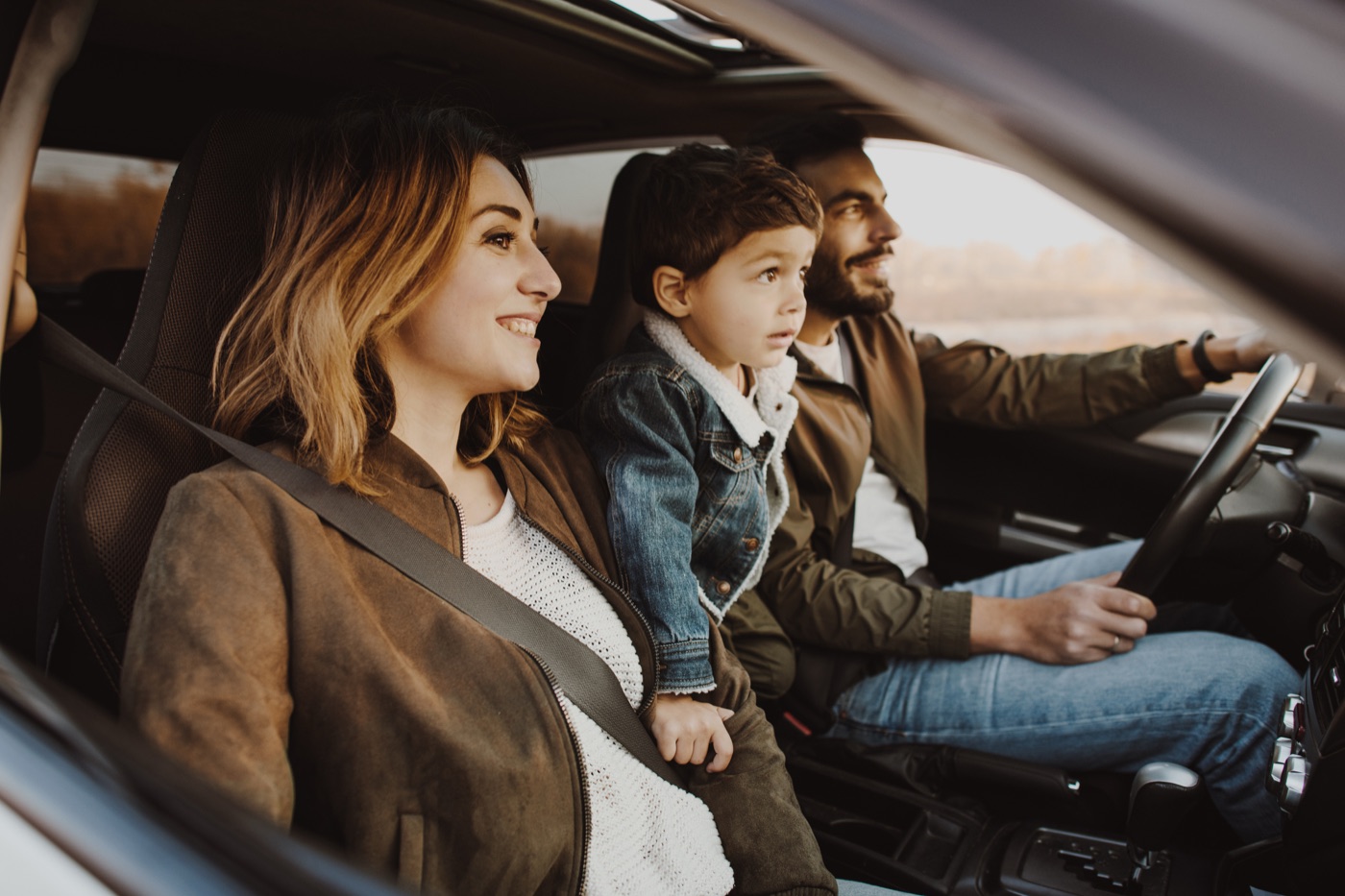 Happy family in a clean car enjoying the ride
